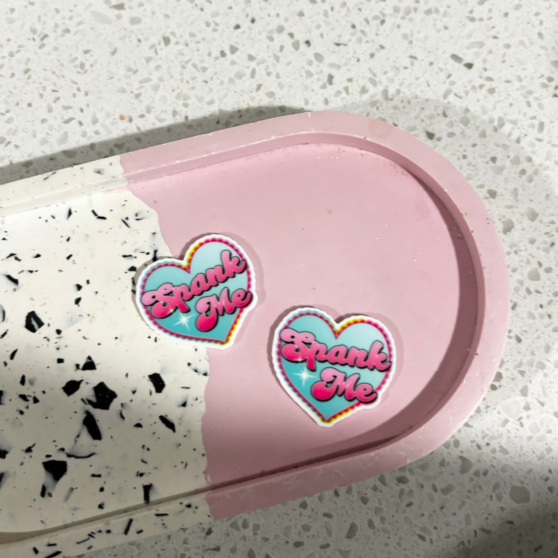 spank earring studs